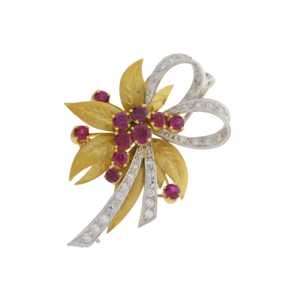 Ruby and diamond spray brooch with textured gold leaves in 18ct gold mount