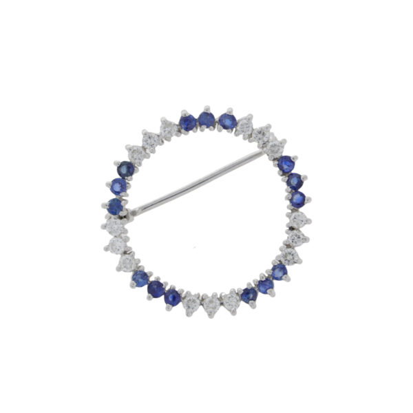 Sapphire and diamond open circle brooch, platinum mount