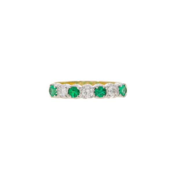 Emerald and diamond seven stone half eternity ring, 18ct gold mount