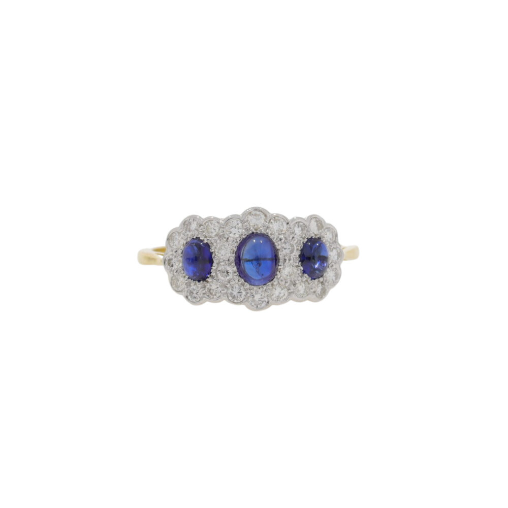Cabochon sapphire and diamond triple cluster ring, 18ct yellow gold mount
