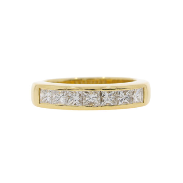 Diamond Princess cut seven stone channel set half eternity ring, 18ct yellow gold mount